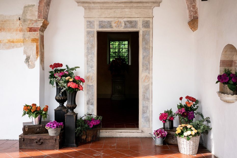 wooden doorway with flowers in pots at Italian wedding venue convento dell'Annunciata
