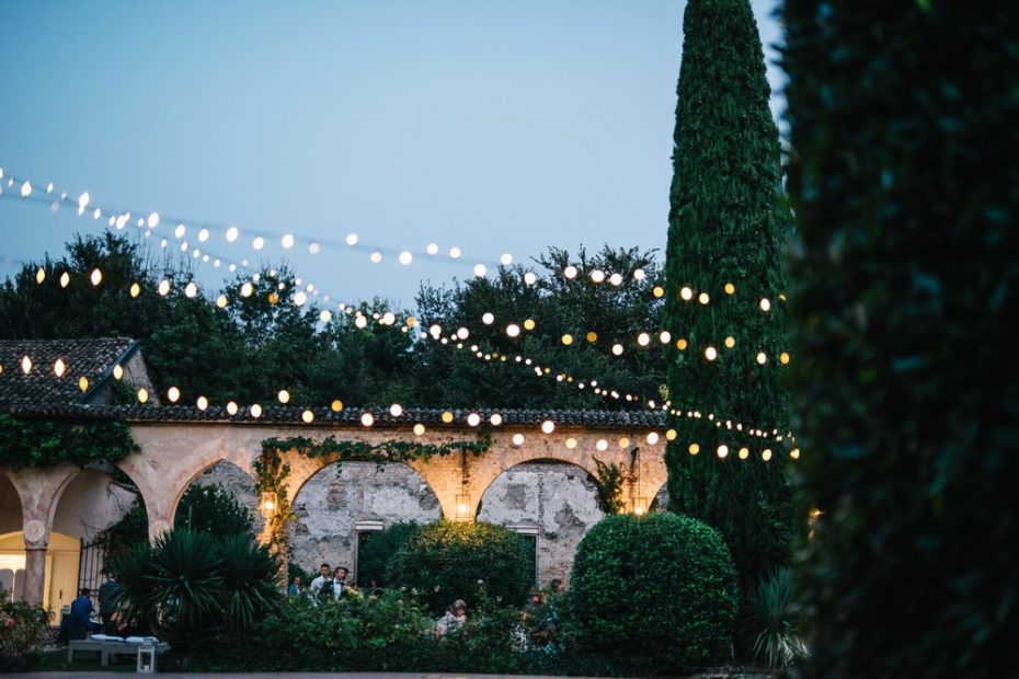 fairy lights strewn across the lawn at Italian wedding venue convento dell'Annunciata