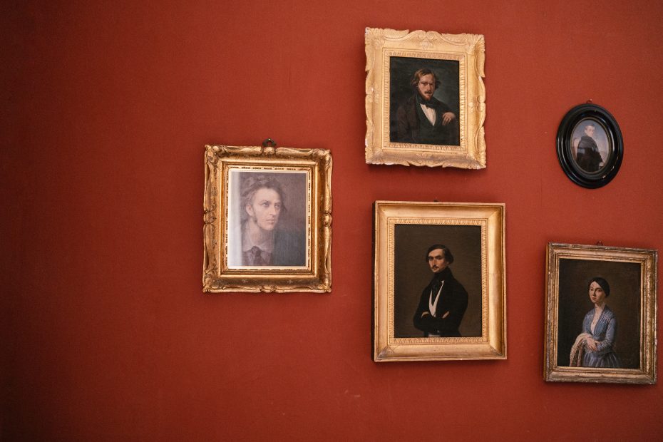 red wall with five antique photo frames at Italian wedding venue