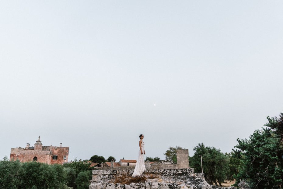 bride stood on top of old wedding venue masseria spina in Italy