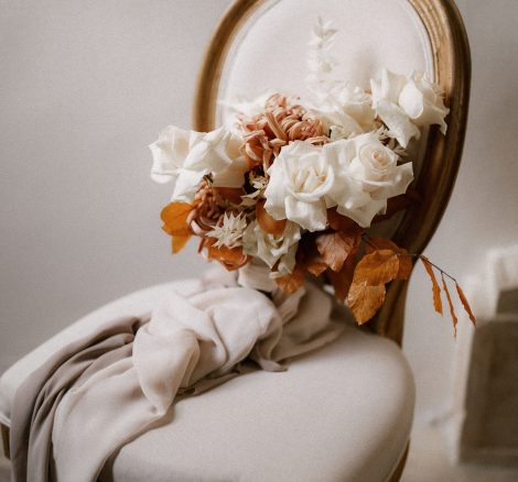 Bridal bouquet with linen ribbon on chair at Italian wedding venue Villa Imperiale