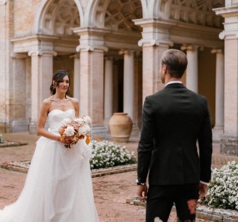 bride and groom first look at historic Italian wedding venue Villa Imperiale