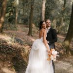 bride and groom stood together in the forest at Italian wedding venue Villa Imperiale