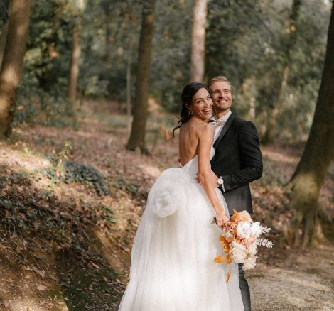 bride and groom stood together in the forest at Italian wedding venue Villa Imperiale