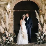 bride and groom surrounded by pampas grass at Italian wedding venue Antico convento i cappuccini di montalcino