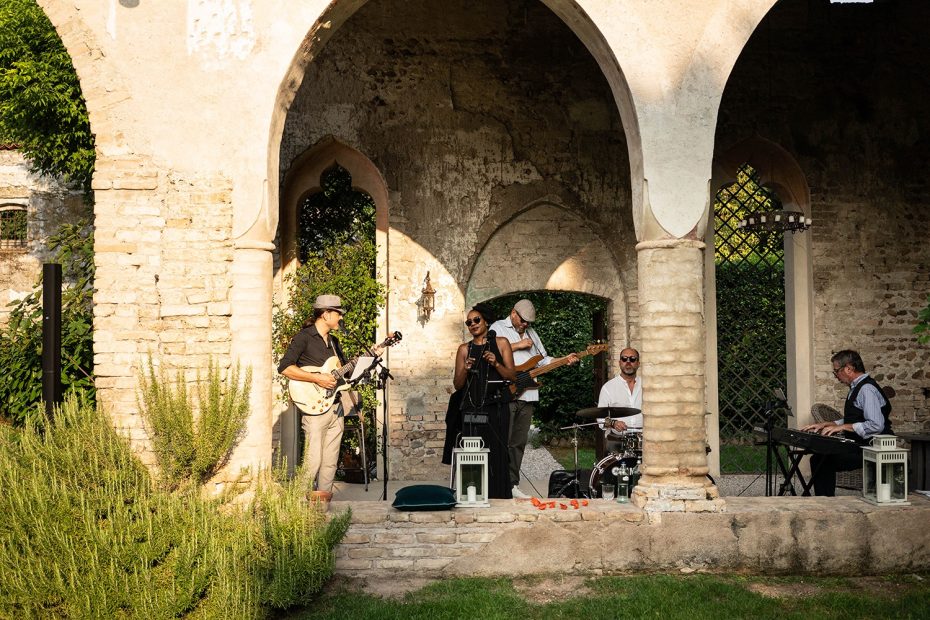 cloisters with musicians performing under