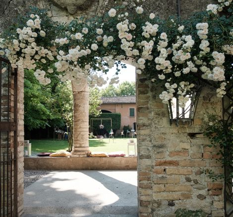 archway and white flowers at Italian wedding venue convento dell'Annunciata