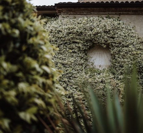 foliage growing over the stone exterior at Italian wedding venue convento dell'Annunciata