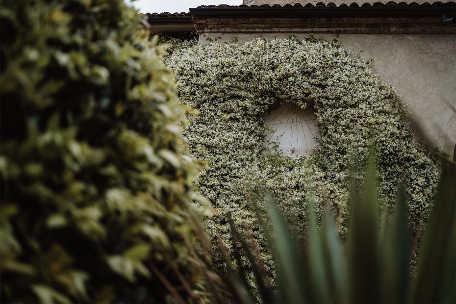 foliage growing over the stone exterior at Italian wedding venue convento dell'Annunciata