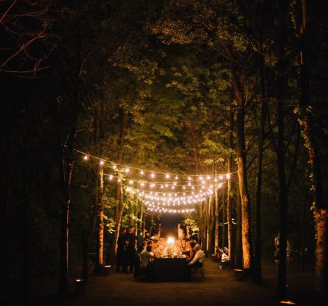fairy lights draping a wedding reception in the forest at Italian wedding venue convento dell'Annunciata