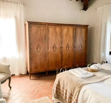 wooden wardrobe in gust suite at Italian wedding venue Antico convento i cappuccini di montalcino