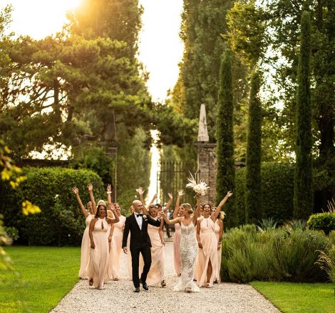 bridal party all walking towards the camera through the grounds at Italian wedding venue convento dell'annunciata