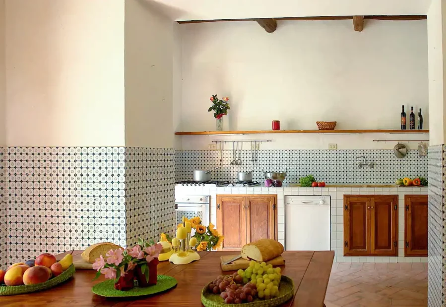 kitchen with tiled walls at Italian wedding venue Antico convento i cappuccini di montalcino