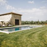 lush green grass by pool area outside of wedding venue in south of France le petit roulet