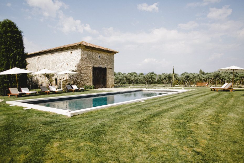 lush green grass by pool area outside of wedding venue in south of France le petit roulet