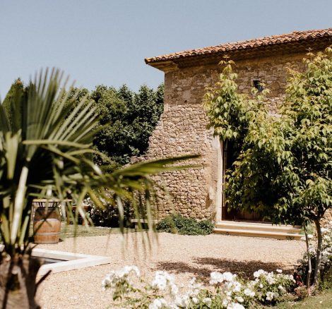 stone exterior of fortified medical farmhouse turned wedding venue in south of France le petit roulet