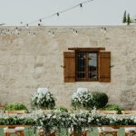 wooden shutters on window in stone wall facade at wedding venue in Cyprus liopetro