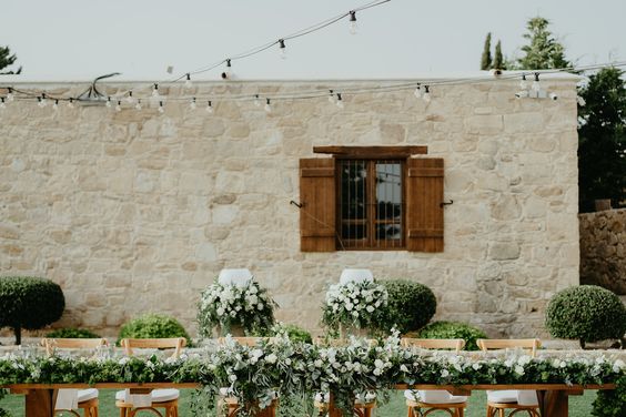 wooden shutters on window in stone wall facade at wedding venue in Cyprus liopetro
