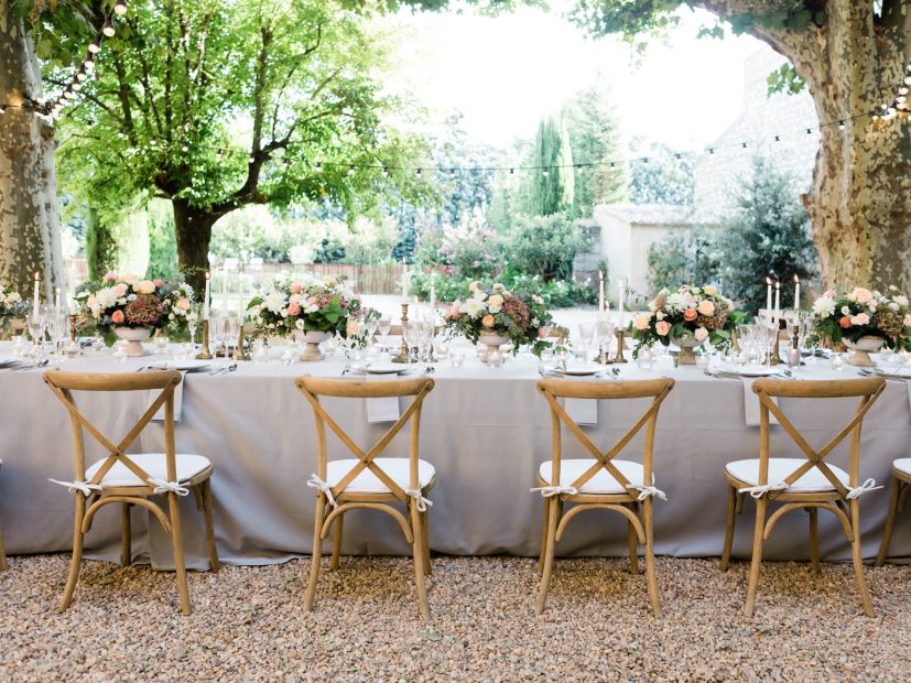 the backs of 4 wooden wedding chairs at le Petit Roulet wedding venue in luberon in france