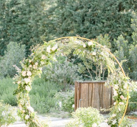 floral circular arch for wedding at French wedding venue le petit roulet