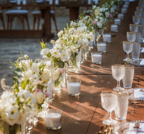 long wooden wedding tables set up at wedding venue in Cyprus liopetro