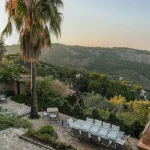 tall palm and views across Mallorca countryside at Mallorca wedding venue ca's xorc in soller