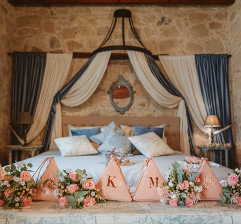 bridal suite with fabric draped behind the bed at unique wedding venue in Cyprus liopetro