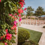 wedding ceremony set up with wooden chairs at liopetro a stunning wedding venue in Cyprus