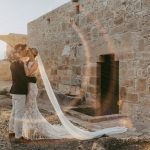 bride and groom at sundown at wedding venue in Cyprus liopetro