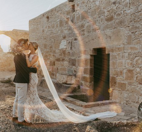 bride and groom at sundown at wedding venue in Cyprus liopetro