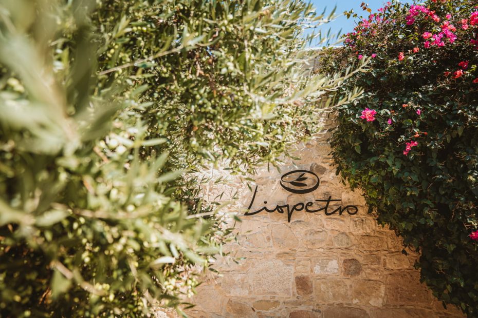 entrance sign on stone wall at wedding venue in Cyprus liopetro