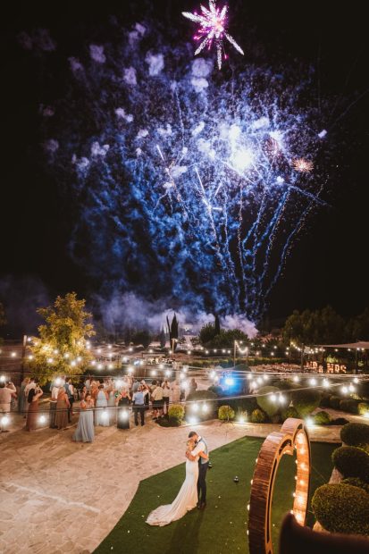 bride and groom stood together admiring fireworks at wedding venue in Cyprus liopetro