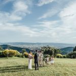 bride and groom wedding ceremony outside at wedding venue in italy castello di petrata