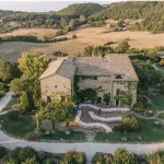 drone shot of wedding venue Castello di Petrata with dining tables out front