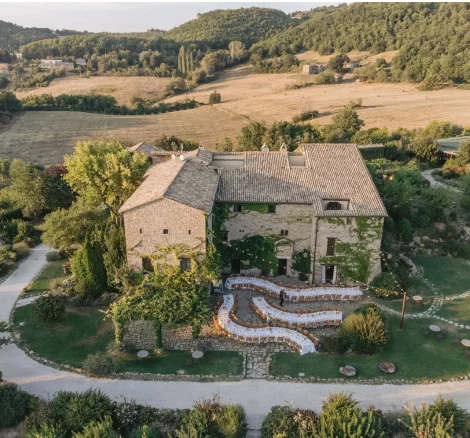 drone shot of wedding venue Castello di Petrata with dining tables out front