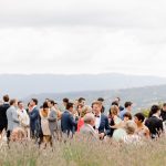 wedding guests mingling outdoors at le grand banc luxury destination wedding venue in france