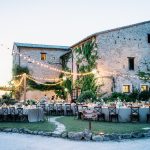 al fresco dining at sundwon oustide historic wedding venue in italy castello di petrata