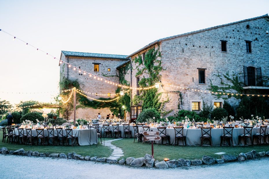 al fresco dining at sundwon oustide historic wedding venue in italy castello di petrata