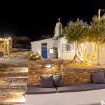 night time view of the white washed walls at the secret view wedding venue in paros greece