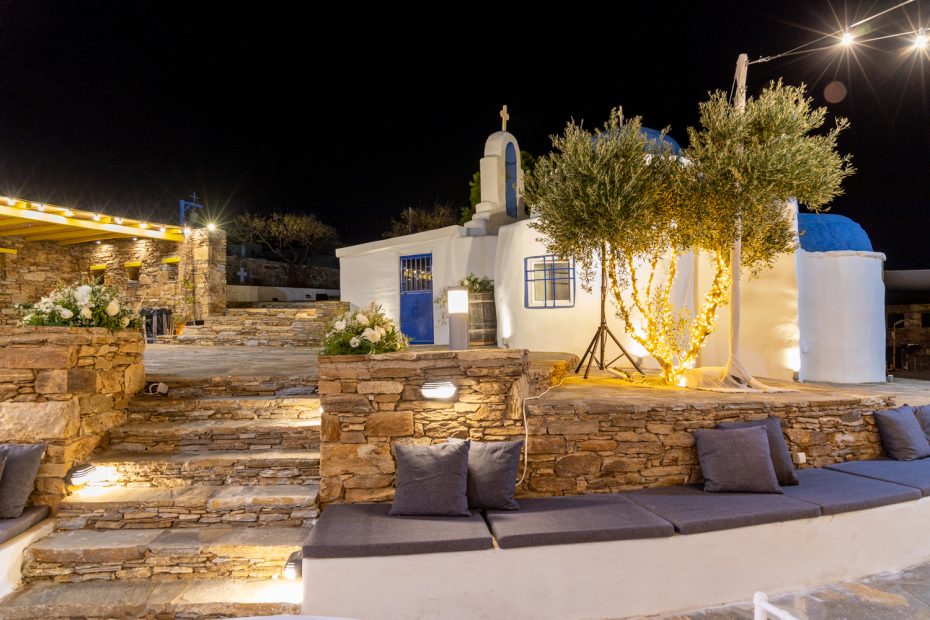 night time view of the white washed walls at the secret view wedding venue in paros greece