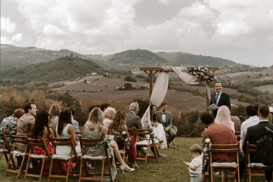 wedding guests seated for an outdoor ceremony at wedding venue Borgo Castello Panicaglia