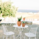 white metal chairs at the secret view wedding venue in paros greece