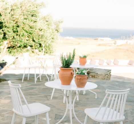 white metal chairs at the secret view wedding venue in paros greece