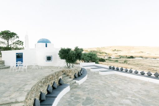 wide angle shot of the large outdoor area for a wedding at the secret view wedding venue in paros greece