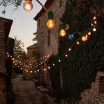 fairy lights outside rustic building at le grand banc luxury destination wedding venue in france