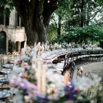 long curved tables outside at wedding venue in Tuscany Italy Borgo Stomennano