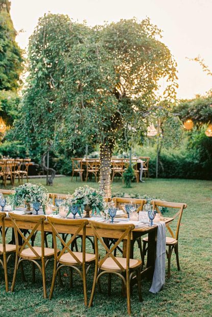 wedding tables and firelight tree at wedding venue villa in corfu Greece at villa Sylva