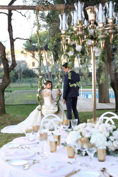 bride on swing at historical private villa wedding venue in Sorrento Italy villa zagara