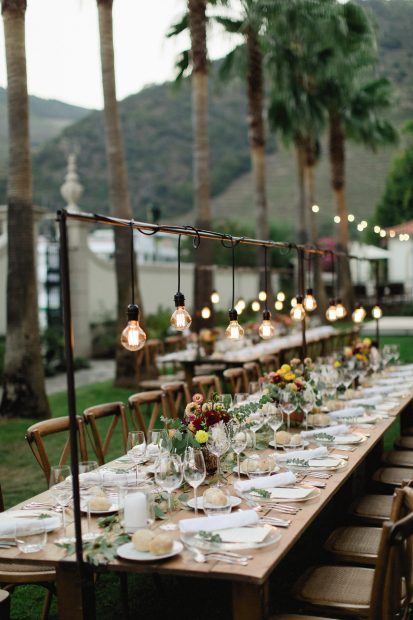 wooden long tables set up for wedding at Douro valley wedding venue in portugal the vintage house hotel