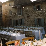 Image of table set up with fairy lights at wedding venue Le Clos du Tuilier, France